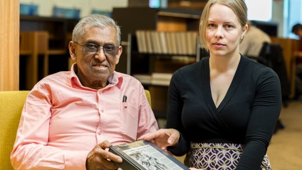 Retired journalist Don Abey with National Library of Australia reference librarian Sonja Barfoed holding a folder similar to the one stolen from his car in Chisholm. The stolen folder contained his memoirs.