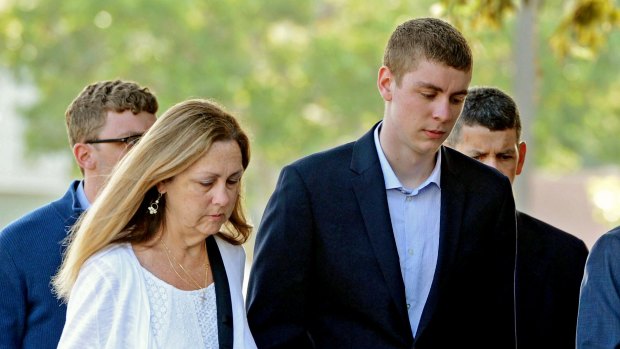 Brock Turner, right, attends court. 