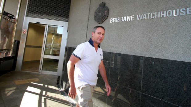 Andrew Crook, Clive Palmer's media adviser, leaves Brisbane Watchhouse.