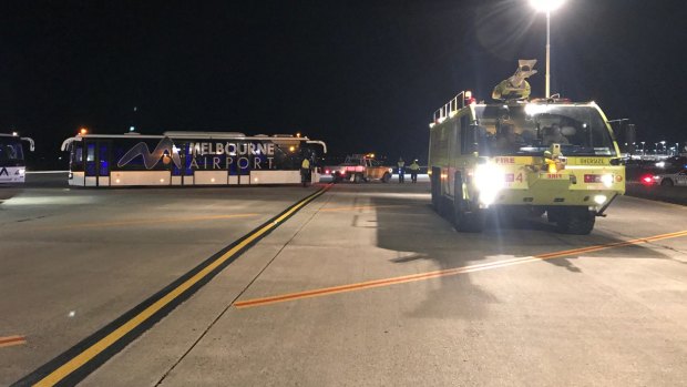 A police vehicle on the tarmac at Melbourne Airport after a man allegedly tried to enter the cockpit of Malaysia Airlines Flight MH128.