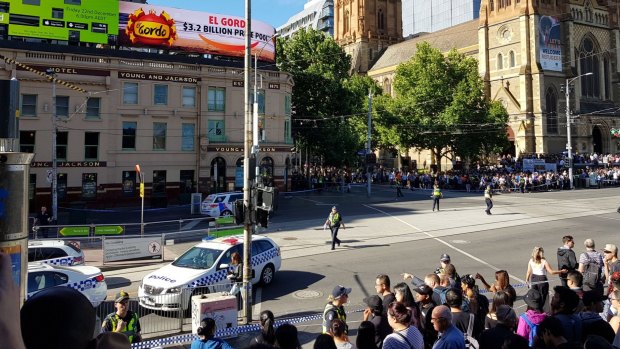 The scene after pedestrians were hit by an SUV on the corner of Flinders and Elizabeth streets.