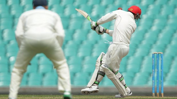 The moment of impact: Hughes is struck under the left ear.