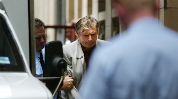 Bandali Debs being led into court in the Gary Silk and Rodney Miller trial.