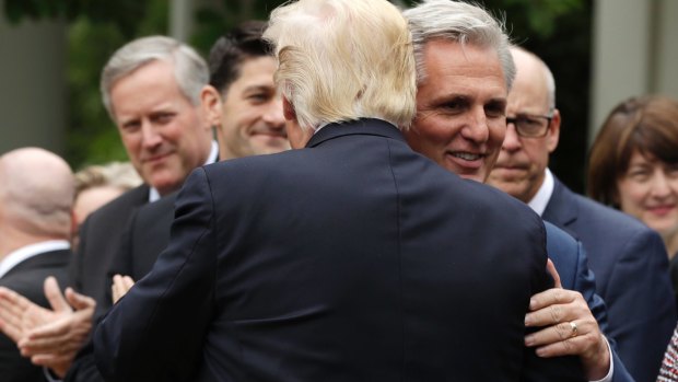 President Donald Trump hugs House Majority Leader Kevin McCarthy of  in the Rose Garden of the White House in Washington, on May 4. 