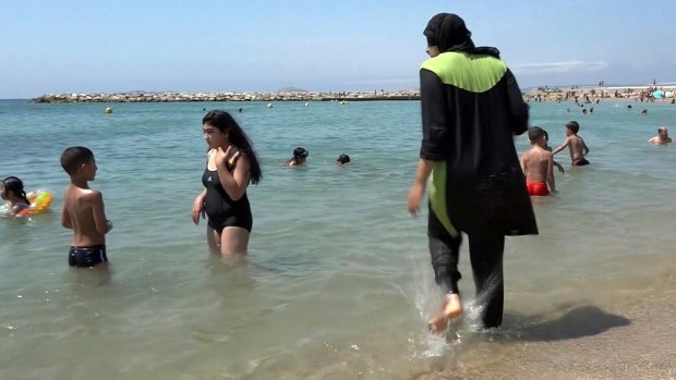A Muslim woman enjoying the beach in Marseille.
