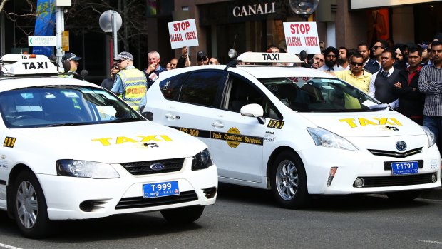 Taxi drivers protested against Uber at NSW State Parliament in September.