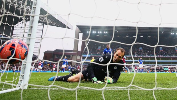 Leicester City's Mark Schwarzer watches a ball from Scott Sinclair hit the back of the net for Villa.