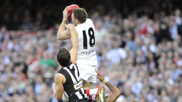 Last gasp: Brendon Goddard soars for a mark in the final quarter of the drawn grand final in 2010.