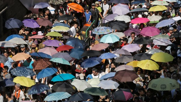 Thousands of people took to the streets of Hong Kong on Sunday to protest against the jailing of democracy activists Joshua Wong, Nathan Law and Alex Chow on Thursday.