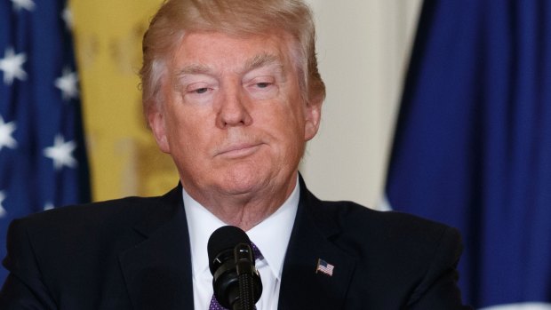 President Donald Trump listens during a news conference with NATO Secretary General Jens Stoltenberg.