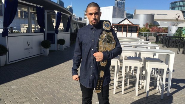 Spoils of war: Robert Whittaker back in Sydney with his newly-won interim middleweight championship.