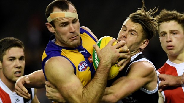 Gotcha: Eagle Shannon Hurn is wrapped up in a tackle against the Saints on Sunday.
