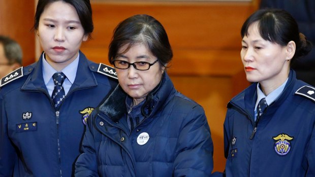 Choi Soon-sil arrives for hearing arguments for Park's impeachment trial at the Constitutional Court in Seoul on January 16.