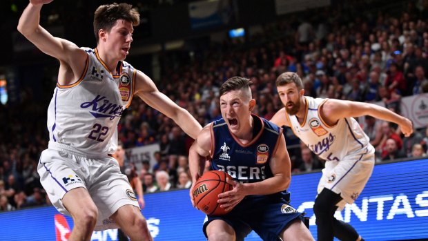 Easy passage: Nelson Larkins of the Adelaide 36ers breaks past Dane Pineau and Adam Thoseby at Titanium Security Arena in Adelaide.