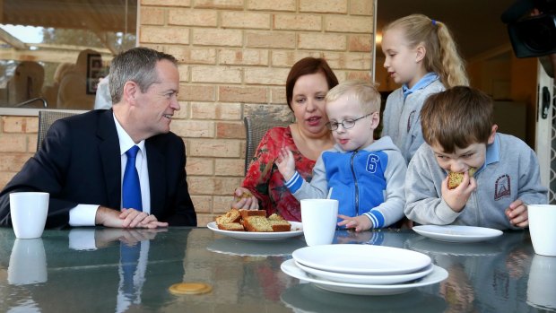 Opposition Leader Bill Shorten spruiked Labor's health policy at morning tea with Natalie Clarke and her children Zac, Caitlin and Jacob in the WA seat of Hasluck.