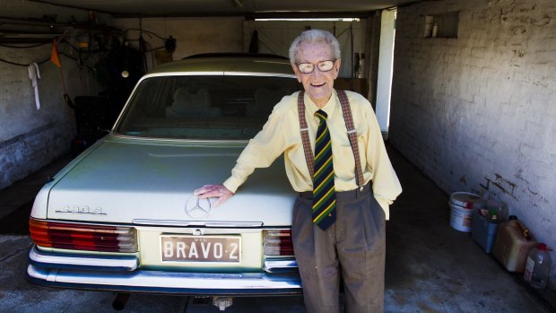 100-year-old Norm Bravo with his Mercedes-Benz — registration BRAVO 2.