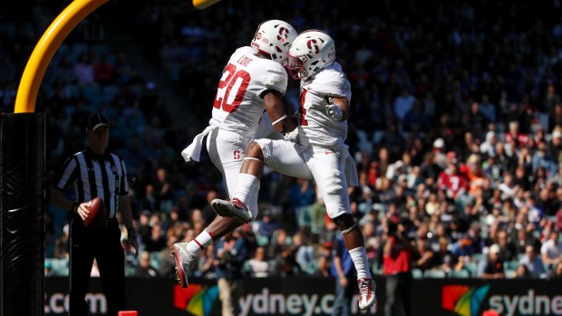 Breakthrough: Bryce Love of the Stanford Cardinal celebrates with Jay Tyler after scoring a touchdown.
