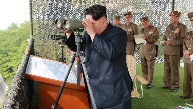 North Korean leader Kim Jong-Un inspecting a firing contest.