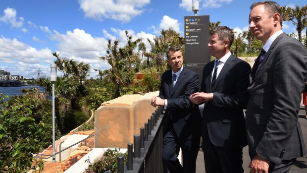 Transport Minister Andrew Constance (left), Premier Mike Baird and Sydney Metro boss Rodd Staples overlook the site for a new train station at Barangaroo.