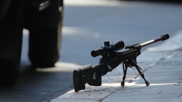 A sniper's rifle on the ground in Phillip Street during the Lindt cafe siege. 