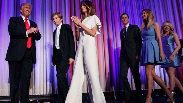 Donald Trump arrives to speak to an election night rally with his family and third wife, Melania. Jared Kushner is third from right.