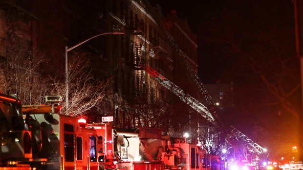Firefighters respond to a deadly fire in the Bronx borough of New York.