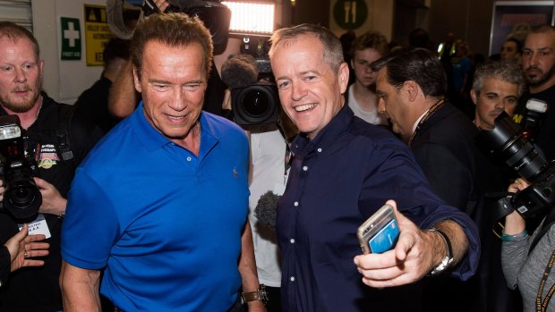 Guard of honour: fans attempted to mob Arnold Schwarznegger at his fitness expo despite his 40-strong 'safety team'. 