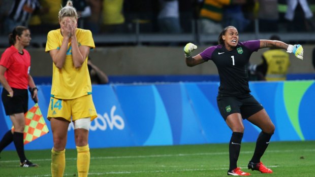 Australia's Alanna Kennedy , left, reacts after missing a shot in a penalty shootout as Brazil goalkeeper Barbara celebrates.