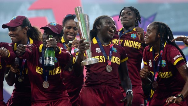Celebration time: West Indies players with the World Twenty20 trophy after their upset final win over Australia.