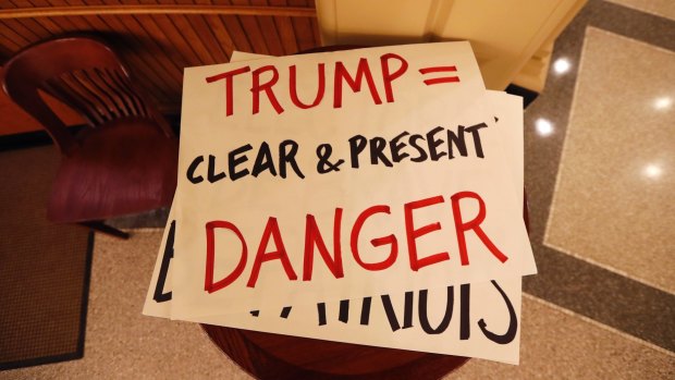 Protesters' signs in Iowa.