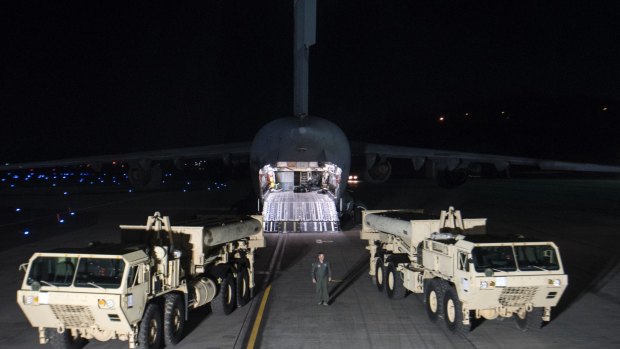 Trucks carrying parts of the Terminal High Altitude Area Defence defense system arrive at Osan air base in Pyeongtaek, South Korea.