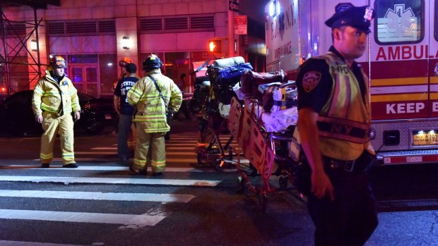 Emergency personnel near an explosion on 23rd Street in New York on Saturday night.