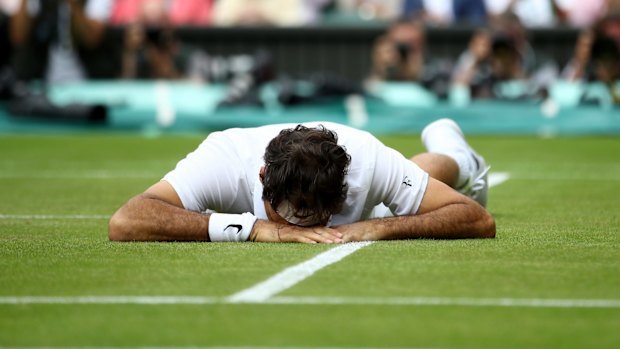 Roger Federer down and out.