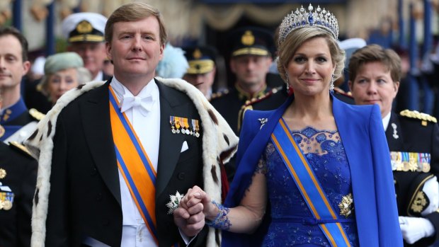 Dutch King Willem-Alexander and Queen Maxima leave after their inauguration ceremony in Amsterdam in 2013.