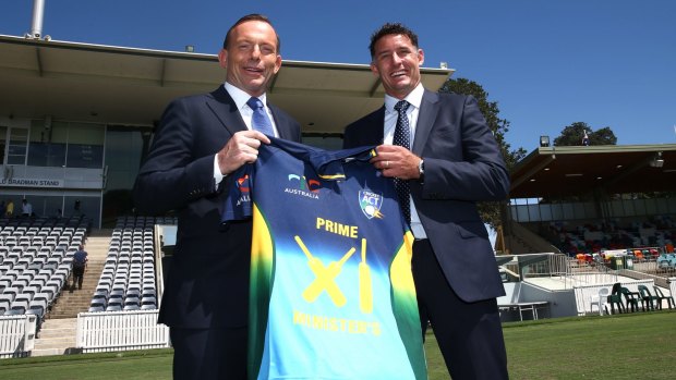Prime Minister Tony Abbott with Michael Hussey.