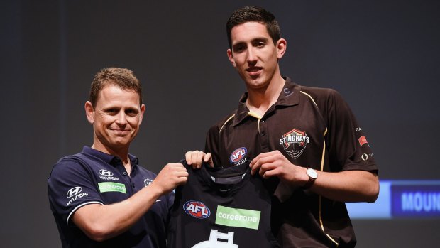 Carlton coach Brendon Bolton with the number one draft pick Jacob Weitering last year.