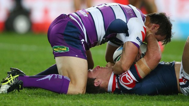 Combatants: Cooper Cronk and James Maloney in the heat of battle when Maloney had moved on to the Roosters.