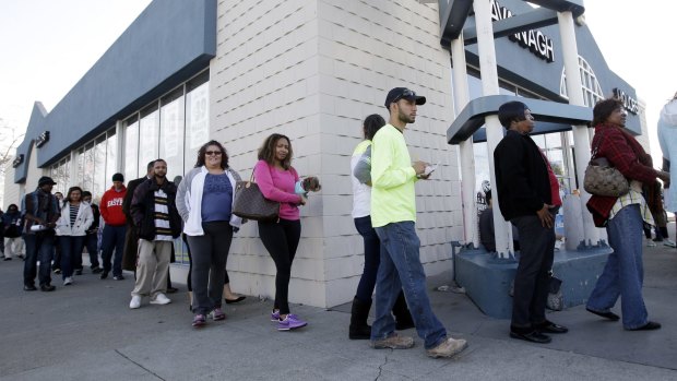 People line up to buy Powerball lottery tickets in California.