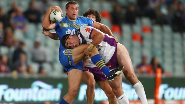 Offload: Danny Wicks looks to get a pass away as he is tackled by Dale Finucane.