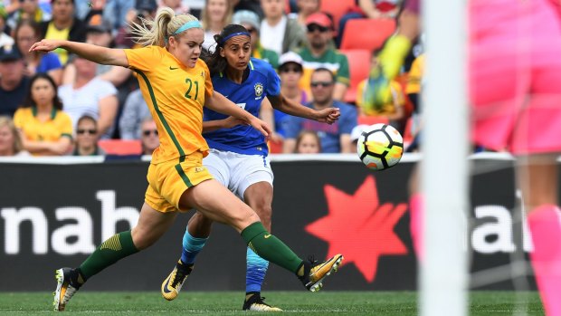 In action against Brazil, Matildas defender Ellie Carpenter thinks the W-League pay deal will help soccer become Australia's No.1 female sport.