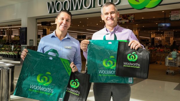Woolworths Group chief executive Brad Banducci, right, and Woolworths Stores director Michael James with the company's new range of bags. 