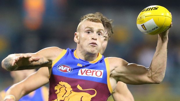 Mitch Robinson of the Lions holds the ball during the round 20 AFL match between the Brisbane Lions and the Carlton Blues at The Gabba.