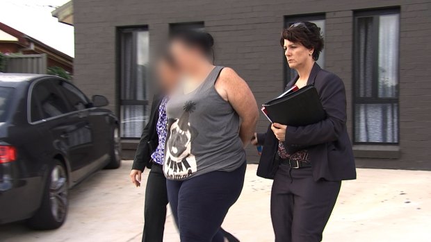 Department of Human Services employee Kristiane Soqosoqo is arrested at Blacktown.