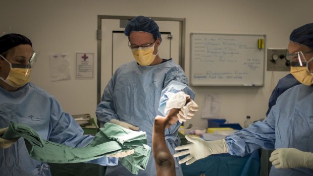 Professor Leo Donnan (centre) performed the surgery.