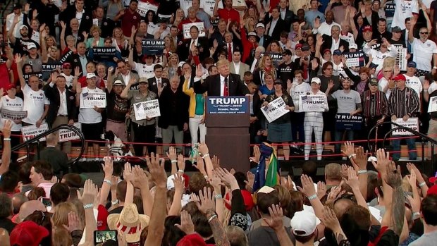 Donald Trump asks supporters to pledge their allegiance to him during a rally in Florida.