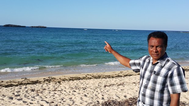 Semuel Messak, the head of Landu village in West Rote, where the Kanak came ashore, points to the rocks where the boat ran aground. 