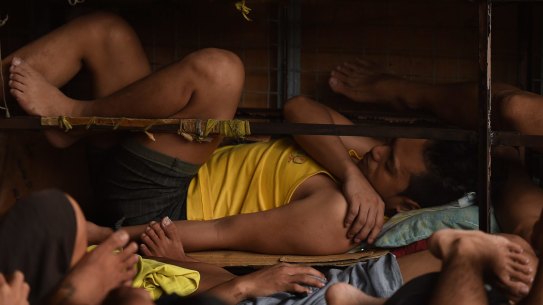 Some of the 3562 inmates sleep on any space they can find in a classroom in Quezon city jail, Philippines. 