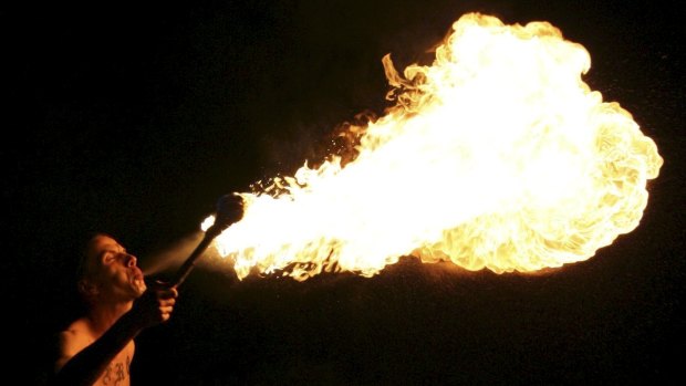 A man has been taken to hospital after a fire breathing accident in Burleigh Heads.