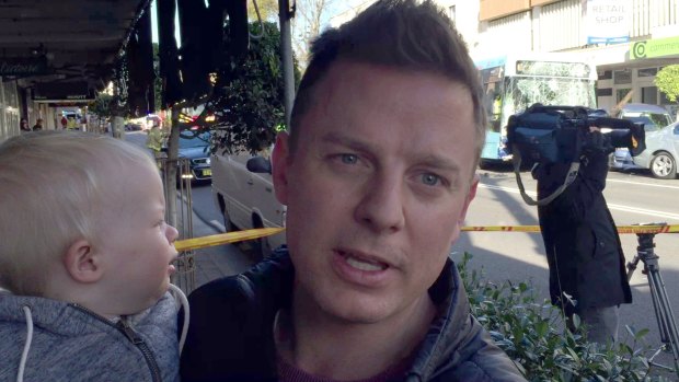 Ben Fordham, holding his son Freddy, helped the bus driver in the Cammeray crash.