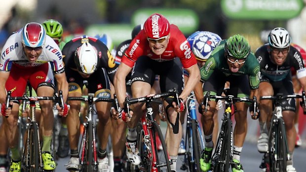 Lotto-Soudal rider Andre Greipel of Germany sprints to cross the finish line to win the final 21st stage of the 102nd Tour de France.